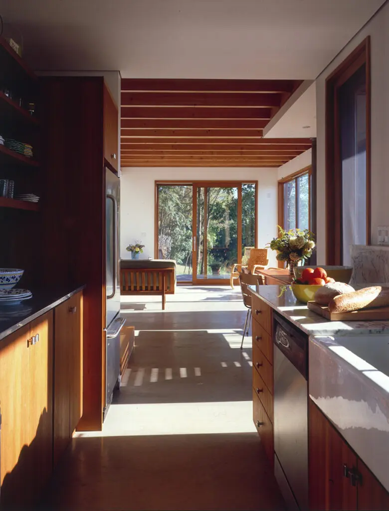 A kitchen with wooden cabinets and a sink.