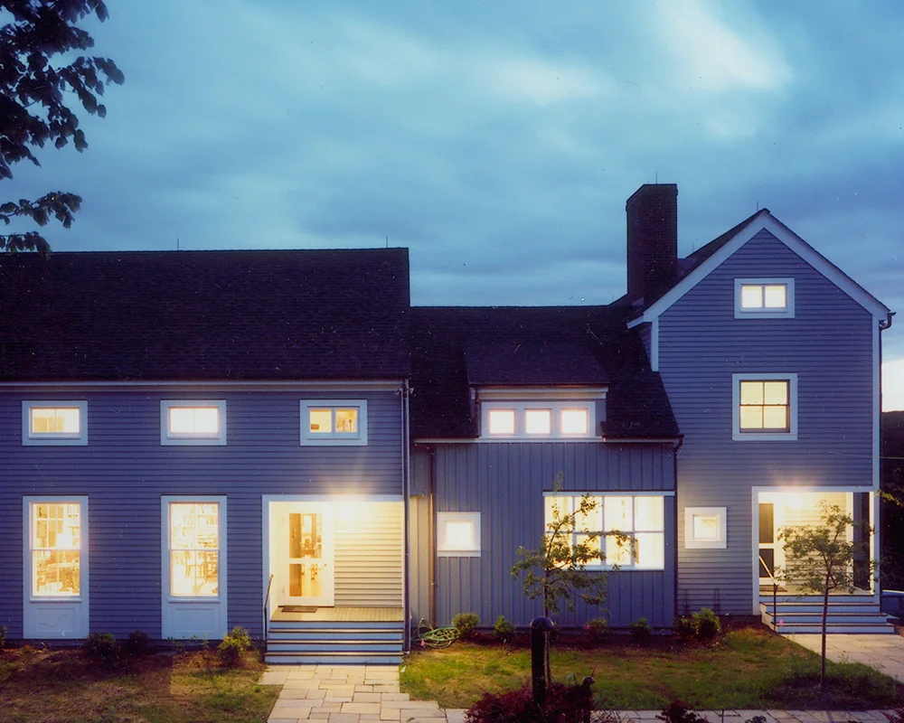 A house with lights on the outside of it